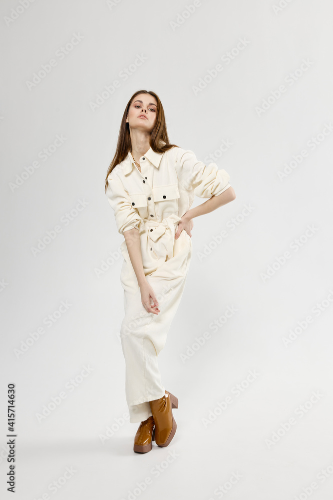 fashionable woman shopping white jumpsuit and brown boots hairstyle fashionable woman shopping white jumpsuit and brown boots hairstyle