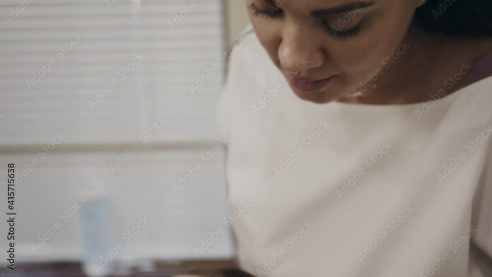 Cosmetologist performing listing operation with device on female patient face with correcting lines on it. Procedure scene in beauty office. Cosmetologist performing listing operation with device on female patient face with correcting lines on it. Procedure scene in beauty office.