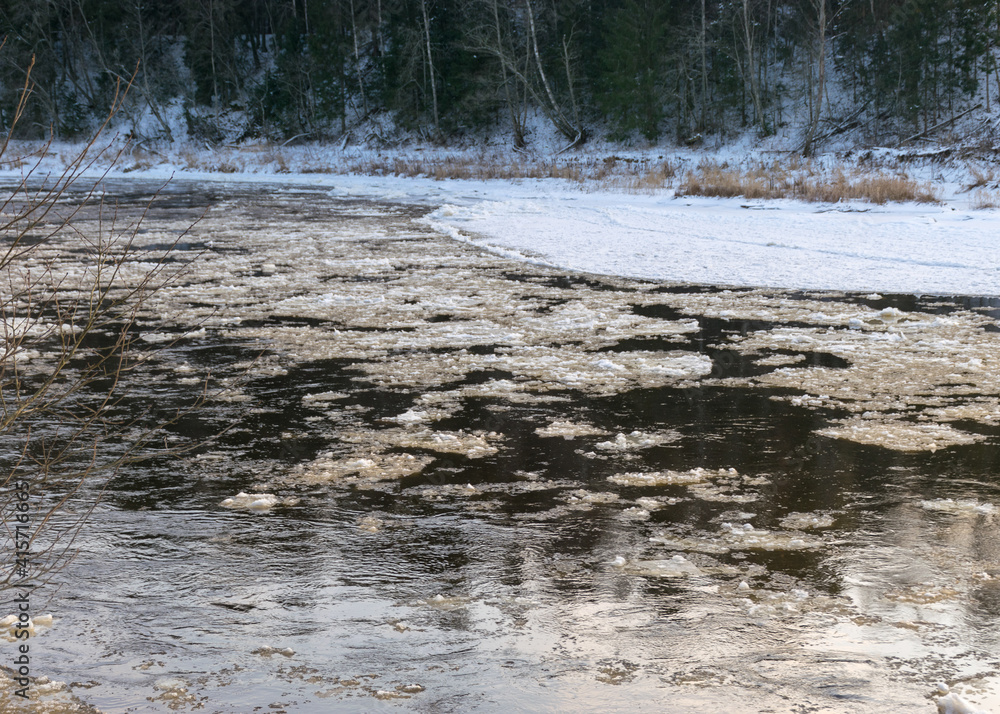 landscape with river in winter, tree-lined river bank, ice on the river, winter day landscape with river in winter, tree-lined river bank, ice on the river, winter day