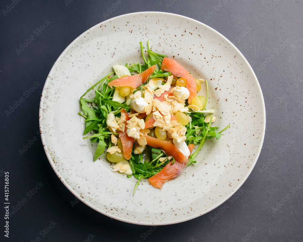 Salad - smoked salmon with vegetables and grapes. Delicious unique recipe, healthy salad for dinner. Salad - smoked salmon with vegetables and grapes. Delicious unique recipe, healthy salad for dinner.