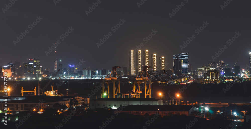 Aerial panoramic cityscape view of Ho Chi Minh city and the River Saigon, Vietnam with beautiful lights at night. Financial and business centers in developed Vietnam Aerial panoramic cityscape view of Ho Chi Minh city and the River Saigon, Vietnam with beautiful lights at night. Financial and business centers in developed Vietnam
