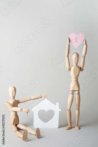 Wooden mannequins with pink...