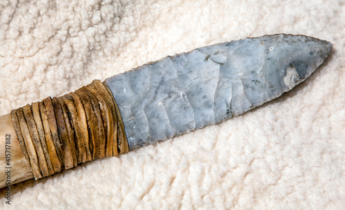 Ancient stone dagger. Historical knife