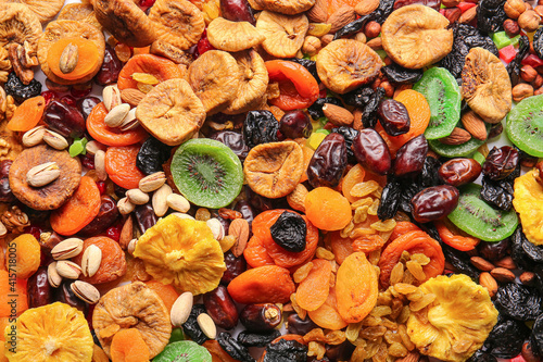 Different dried fruits and nuts as background © Pixel-Shot