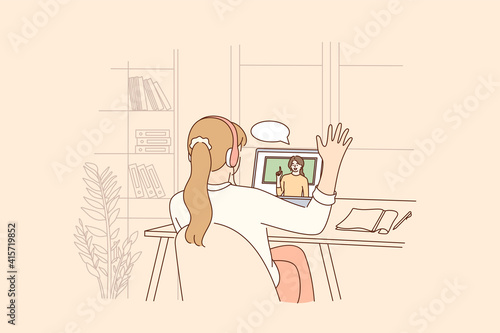 Online education, distant learning during pandemic concept. Homeschool girl student sitting backwards greeting teacher during virtual internet online class during coronavirus epidemic and lockdown