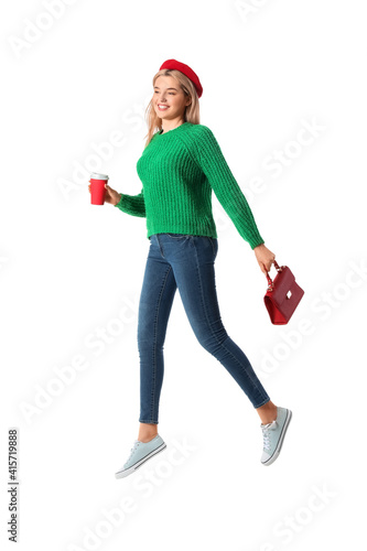 Jumping young woman on whit...