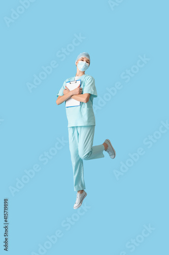 Jumping female doctor on co...