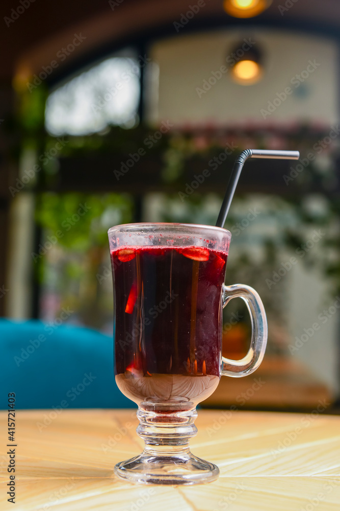 Closeup of mulled wine, one glass of steamy hot red mulled wine. Blurred background, Christmas time. Closeup of mulled wine, one glass of steamy hot red mulled wine. Blurred background, Christmas time.
