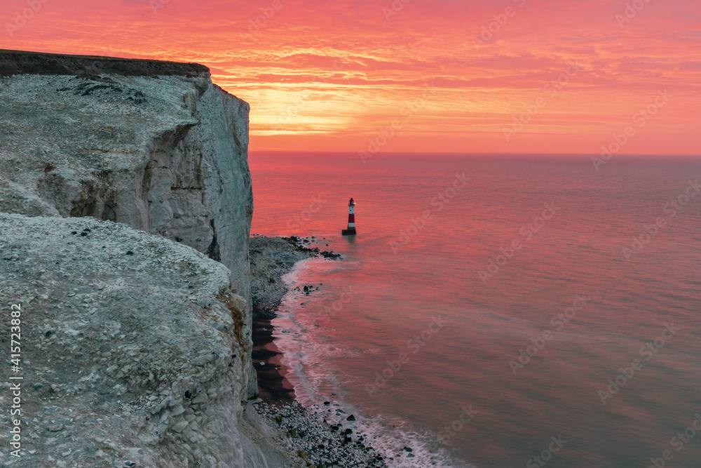 Brilliant colourful sunrise from the cliff edge at Beachy Head East Sussex south east England