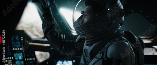 CU Portrait of African American Black male astronaut inside spaceship cockpit. Sci-fi space exploration concept. Intentional shake. Mars mission. Shot with 2x anamorphic lens photo