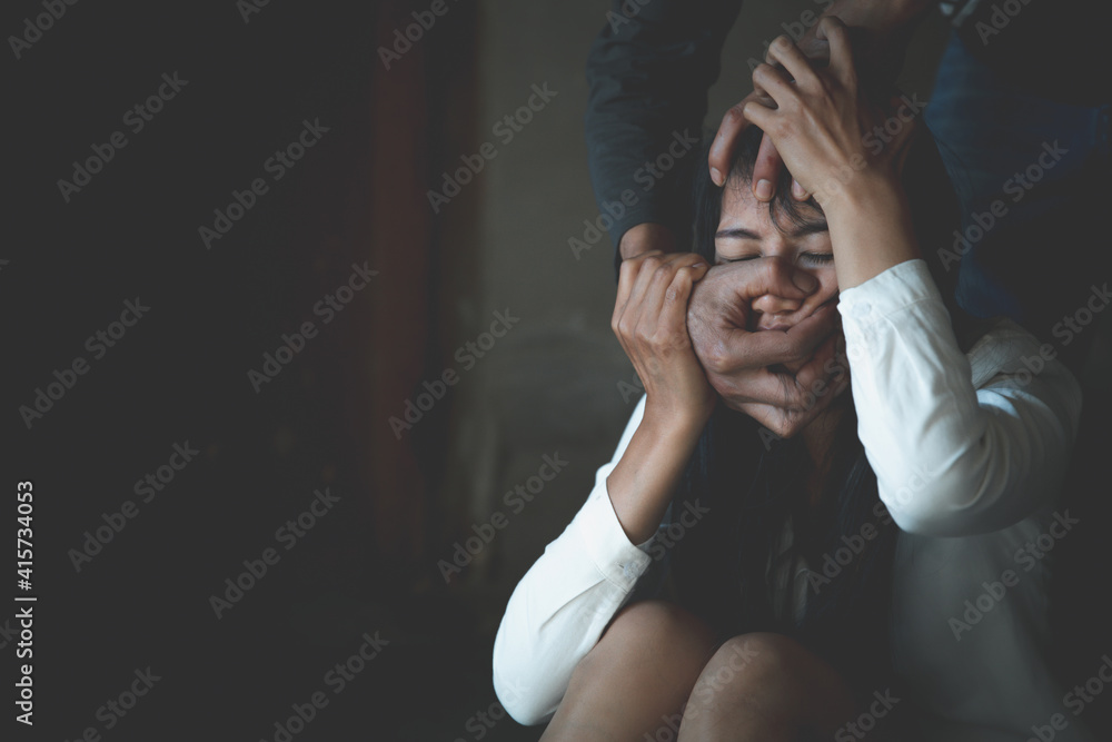 A man use hand to strangle woman neck. stop domestic violence against women campaign. A man use hand to strangle woman neck. stop domestic violence against women campaign.