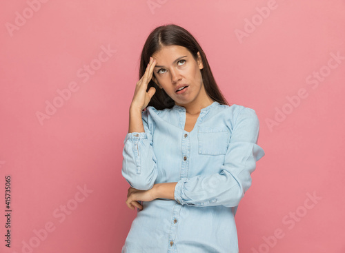 casual woman feeling annoyed by someone and rolling her eyes
