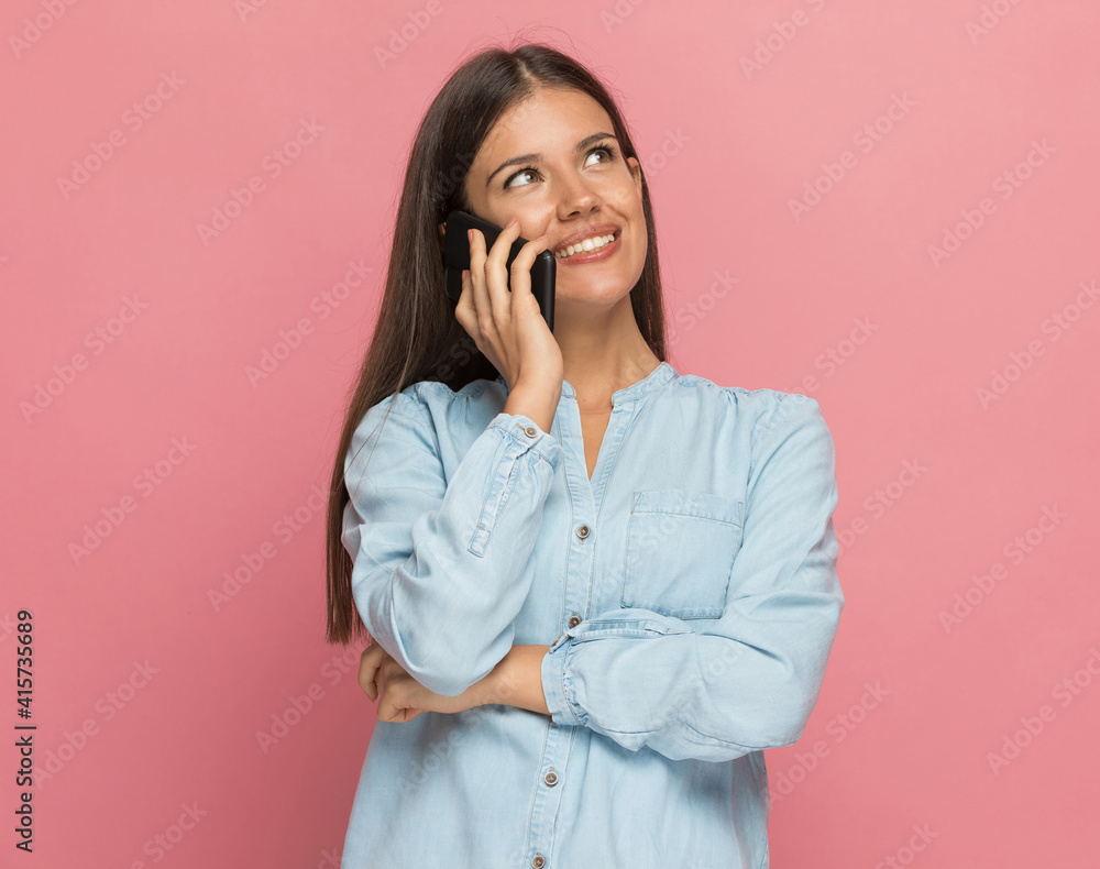 beautiful casual woman feeling pleased by her phone conversation