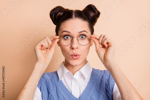 Schilderij op canvas Photo of brunette impressed nice lady wear spectacles white shirt blue vest isol