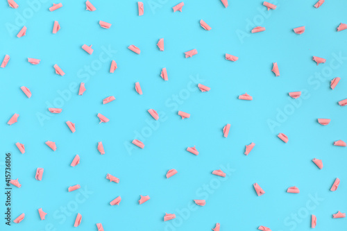 . Leaf shaped pink chocolate, chocolate confectionery sprinkles sprinkled on the background. pattern