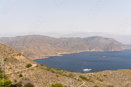 view of the Sierra de Muela mountains and the Bay of Cartagena in Murcia with moored freight ships at anchor