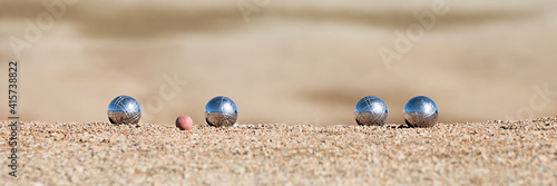 Bild auf Leinwand Metallic petanque four balls and a small wood jack