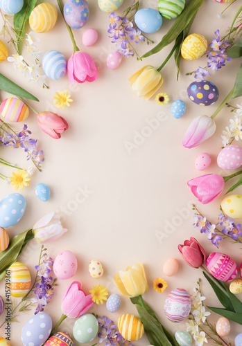 Happy Easter day colorful eggs and flower decoration on paper background with copy space