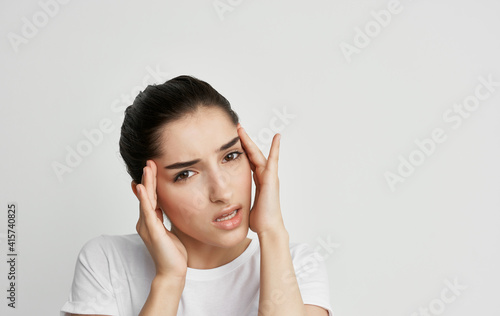 Wallpaper Mural woman holding face headache and migraine health problems Torontodigital.ca