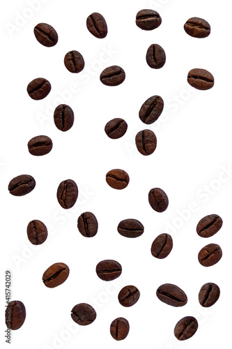 Coffee beans lying chaotically on a white background.