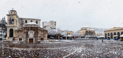 Fototapeta Naklejka Na Ścianę i Meble -  Panorama of the snow covered Monastiraki Square in the center of the old town of Athens, Greece, during a winter day