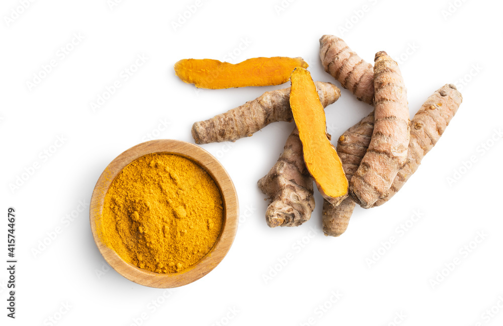 Indian turmeric powder and root. Turmeric spice. Ground turmeric on white background. Indian turmeric powder and root. Turmeric spice. Ground turmeric on white background.