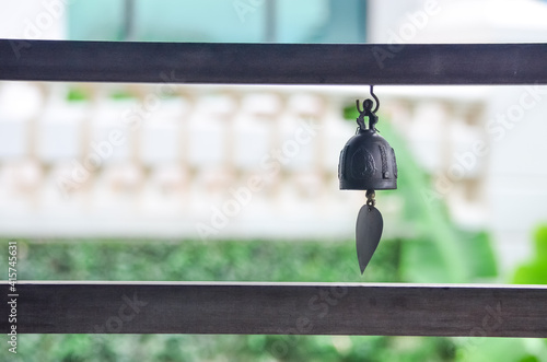 Wallpaper Mural Old bell hanging on the wooden fence. Light opposite. Tradition bronze bells. Natural light Torontodigital.ca