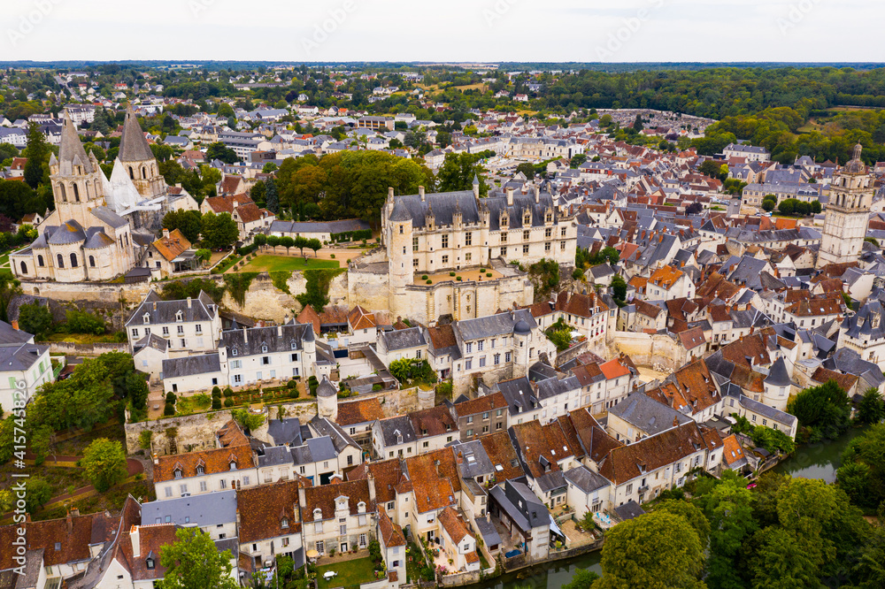 Scenic drone view of medieval fortified castle with royal residence and St Ours church in historic French town of Loches in summer..