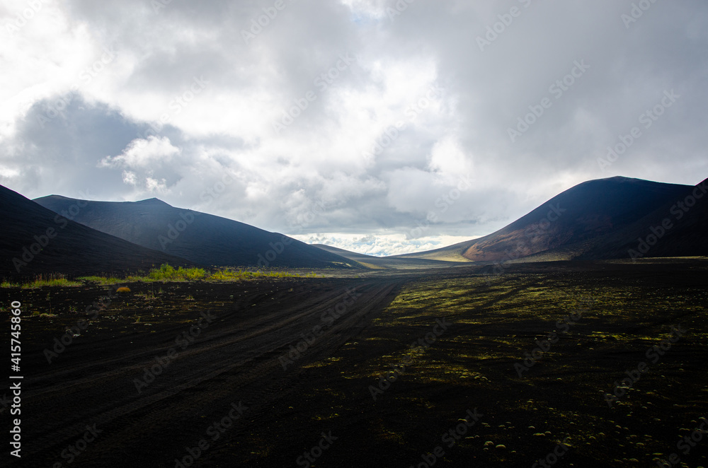 Road in the Ash Desert. Russia, Kamchatka 2020. Photo taken during an expedition to the volcano.