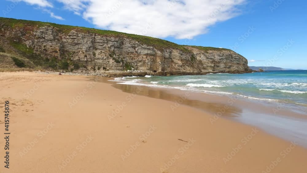 pristine Australian beach shot in Clifton, Tasmania on a serene sunny summer day with turquoise water and golden sand pristine Australian beach shot in Clifton, Tasmania on a serene sunny summer day with turquoise water and golden sand