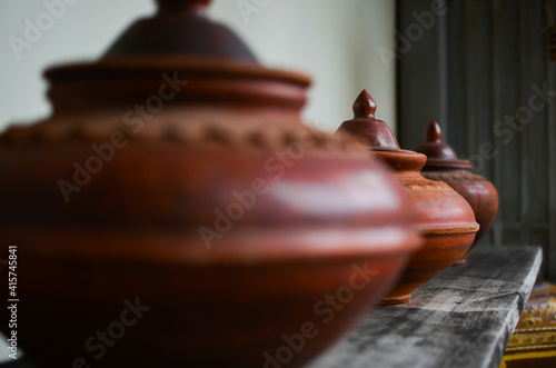 Wallpaper Mural Old fashion brown jar pot on wooden plank agains the wall, beautiful clay soil container crafts Torontodigital.ca