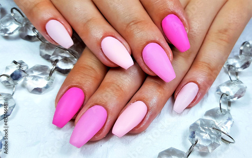 Professional manicure with gel nails painted photo