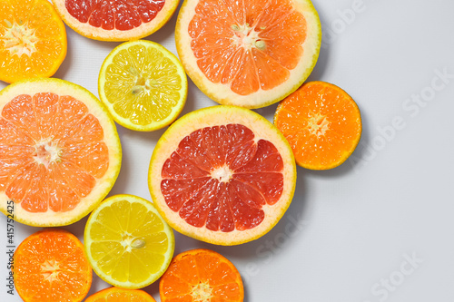 Sliced citrus on a white background. Grapefruit  lemon  tangerine.