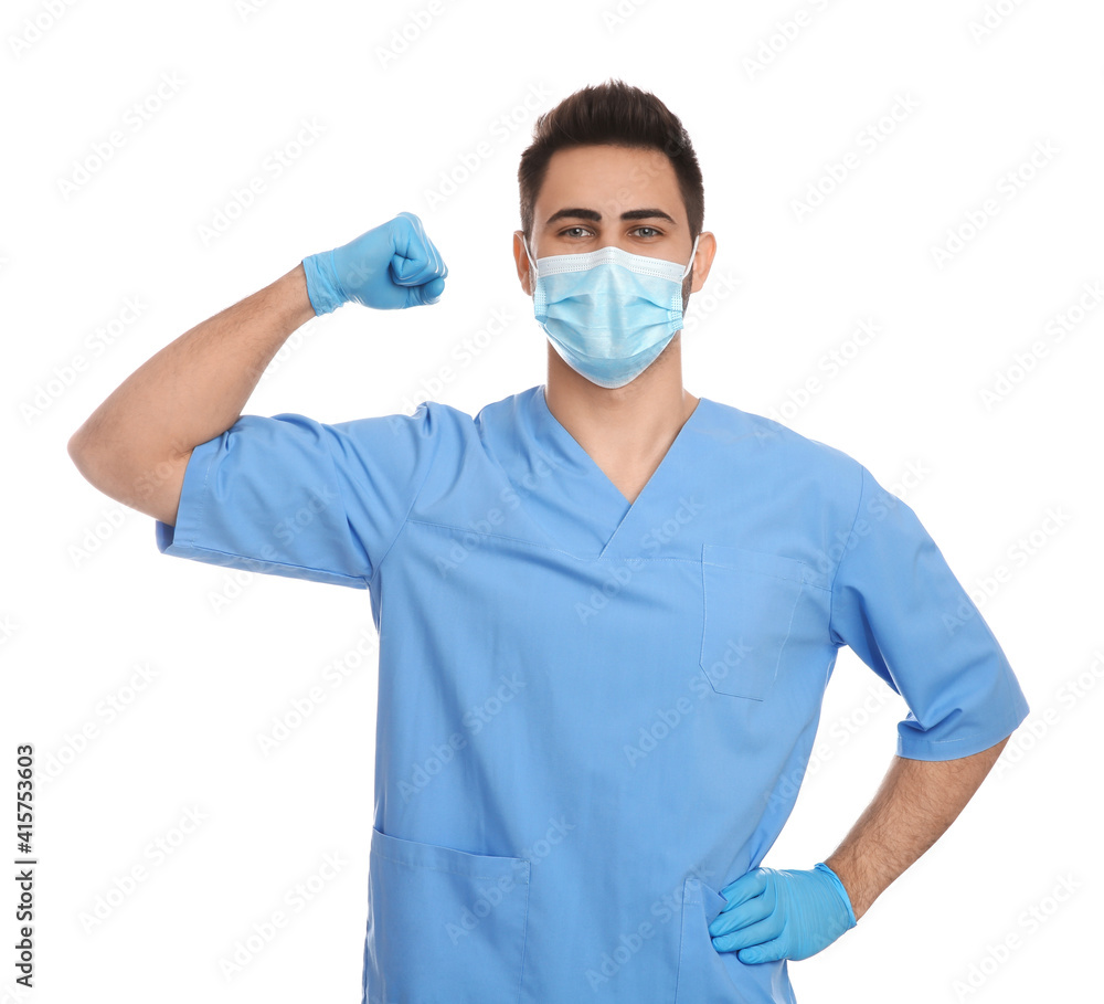 Doctor with protective mask showing muscles on white background. Strong immunity concept Doctor with protective mask showing muscles on white background. Strong immunity concept