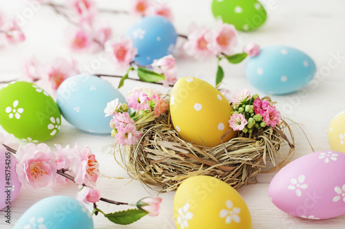 greeting card with colorful easter eggs and spring flowers. mock up frame with copy space