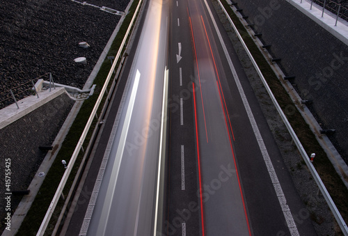 Wallpaper Mural Cars lights driving on the evening road. Top view of traffic on a road corridor. Torontodigital.ca