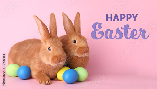 Happy Easter! Cute bunnies and dyed eggs on pink background