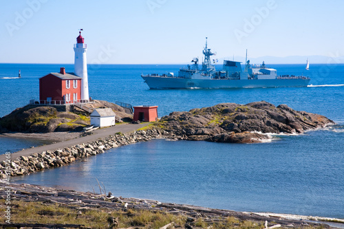 Fisgard Lighthouse with navy destroyer sailing past, Victoria, BC © David