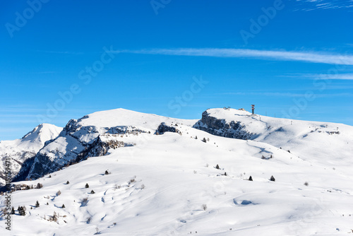 Peak of Malga San Giorgio Ski Resort in winter with snow. Altopiano della Lessinia (Lessinia Plateau), Regional Natural Park, Verona province, Veneto, Italy, Europe. On the left the Monte Carega.