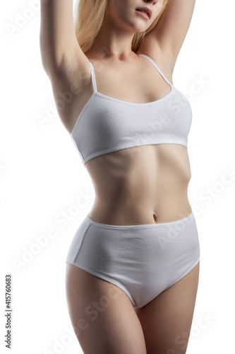 Slim tanned woman's body. Isolated over white background
