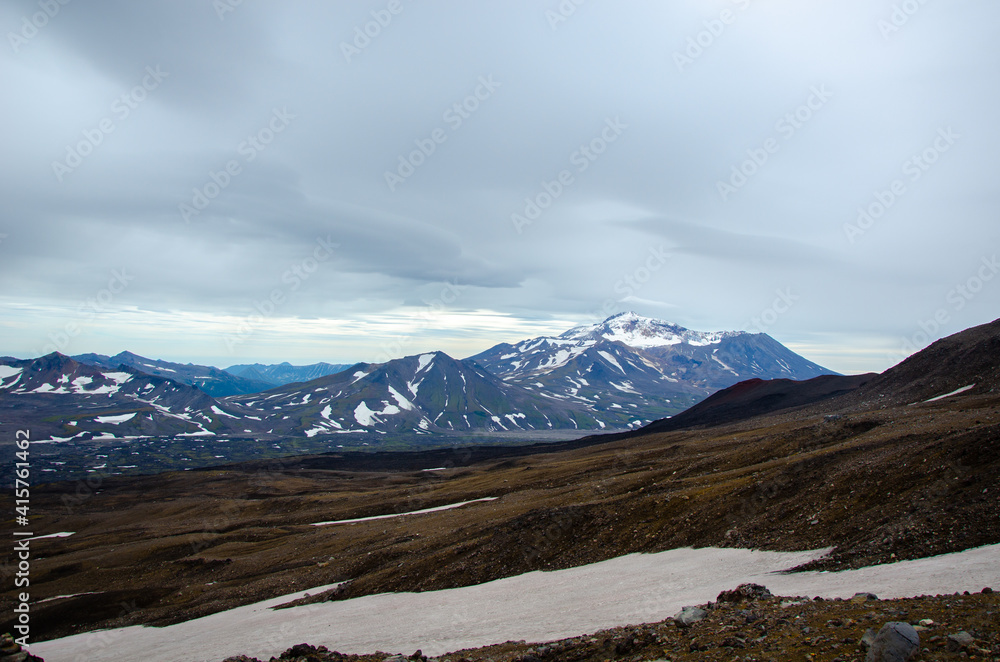 Landscape with Snow and Clouds. Russia, Kamchatka 2020. Photo taken during an expedition to the volcano.