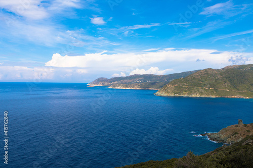 Panoramic view of the mediterranean sea and the mountain range in the background. Cap Corse, Corsica, France. Tourism and vacations concept.