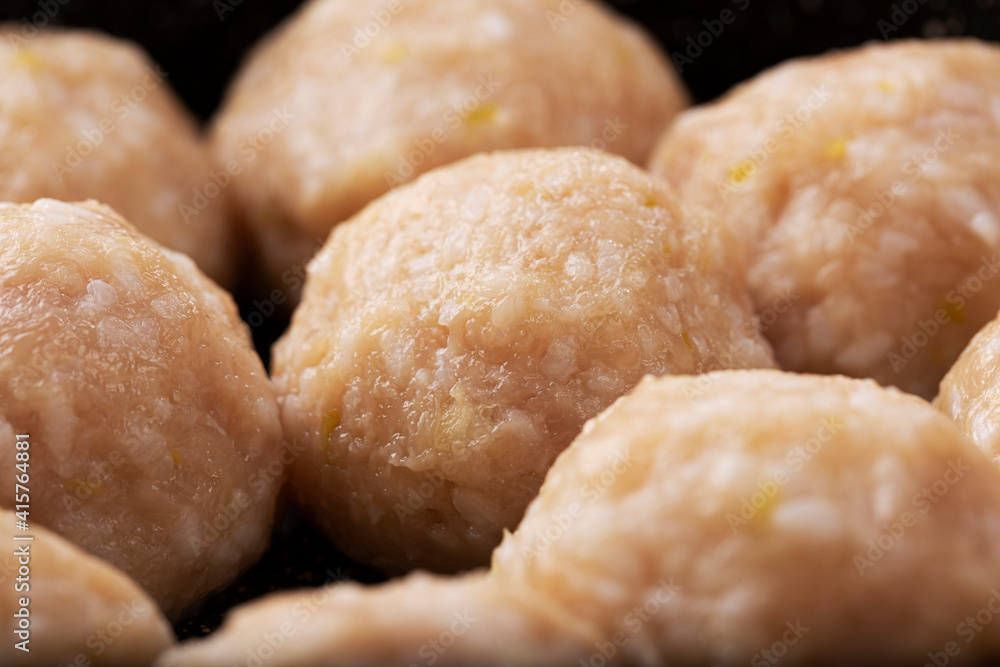 Raw meatballs closeup. Home cooking concept, top view Raw meatballs closeup. Home cooking concept, top view