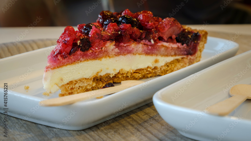 Typical swedish cheesecake with strawberries blackberries blueberries closeup selective focus Typical swedish cheesecake with strawberries blackberries blueberries closeup selective focus