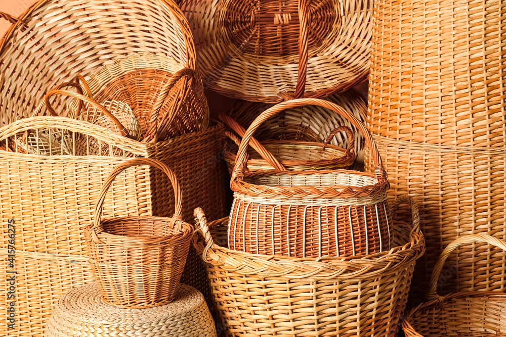 Many different wicker baskets made of natural material as background Many different wicker baskets made of natural material as background