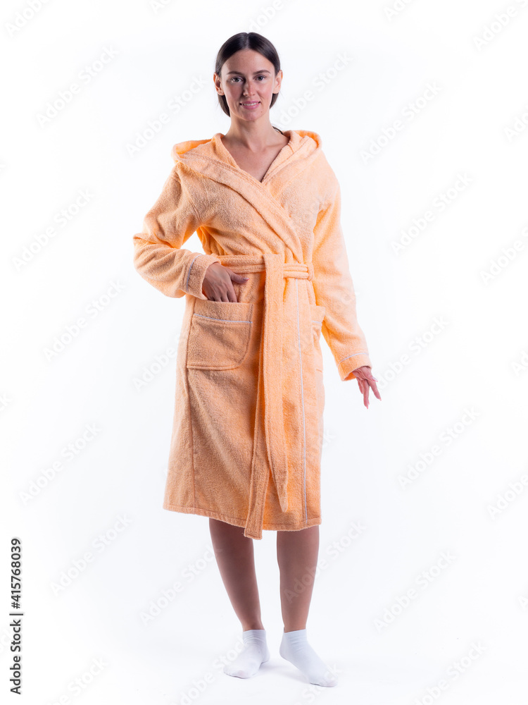 woman in a Bathrobe on an isolated white background with a smile on her face. woman in a Bathrobe on an isolated white background with a smile on her face.