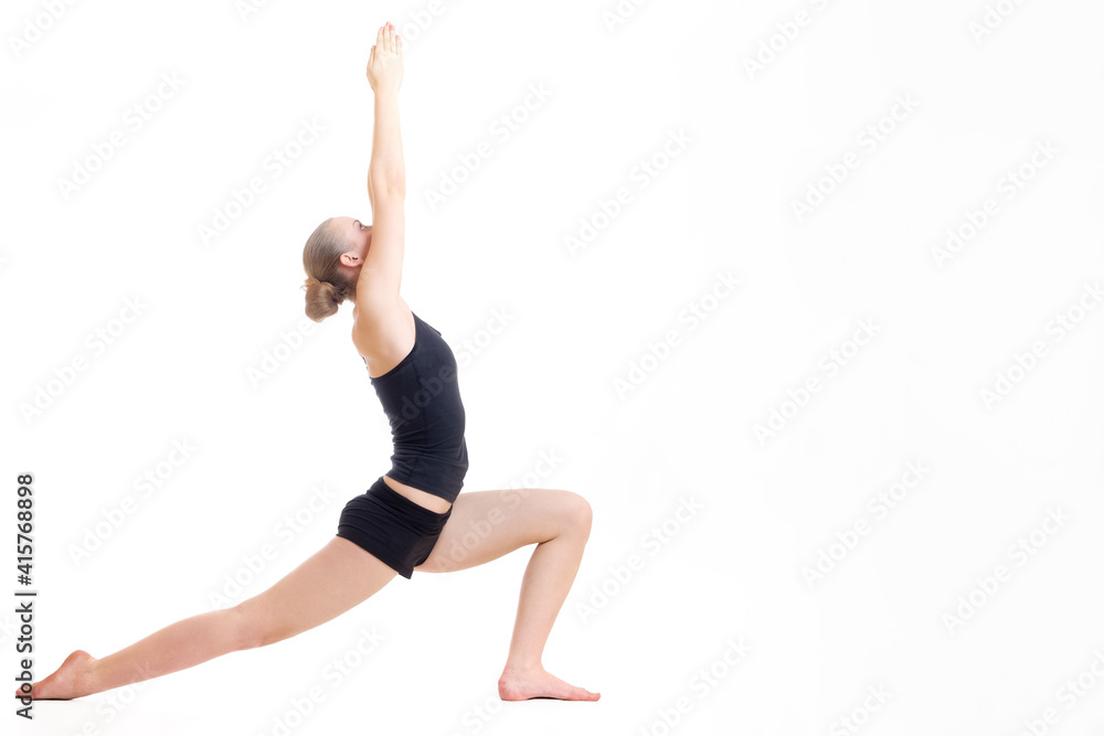 young blond hair woman in yoga pose virabhadrasana or the warrior pose young blond hair woman in yoga pose virabhadrasana or the warrior pose