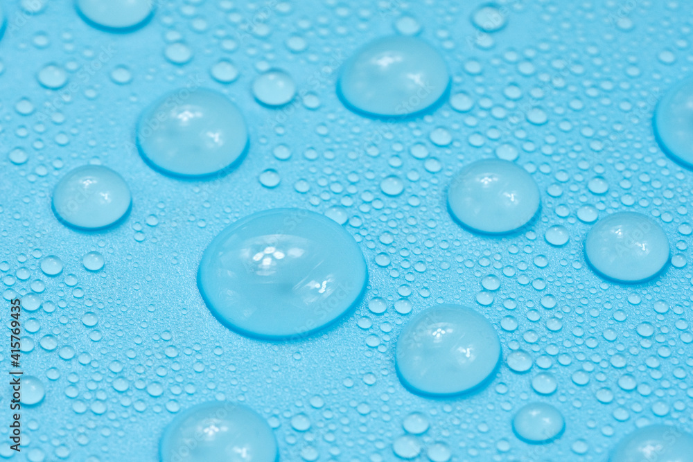 Water drops on blue background texture. Backdrop glass covered with drops of water. bubbles in water Water drops on blue background texture. Backdrop glass covered with drops of water. bubbles in water