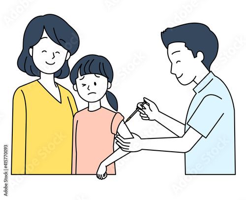 予防接種を受ける子供と母親