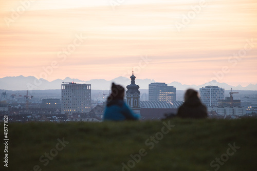 sunset over the city with people